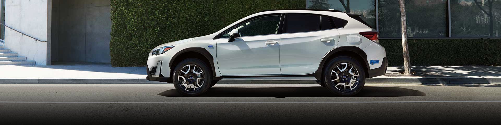 The side profile of a white Subaru Crosstrek Hybrid | Subaru Superstore of Surprise in Surprise AZ